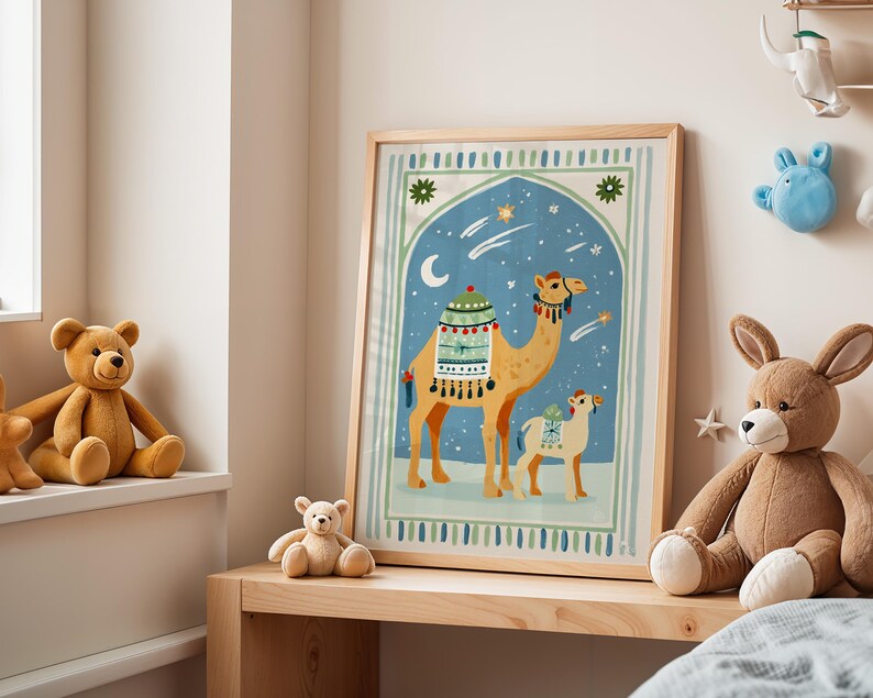 May include: A framed art print featuring a camel and a baby camel against a blue night sky with stars and a crescent moon. The artwork is in a wooden frame and is displayed on a wooden shelf. Teddy bears and a stuffed bunny are also visible.