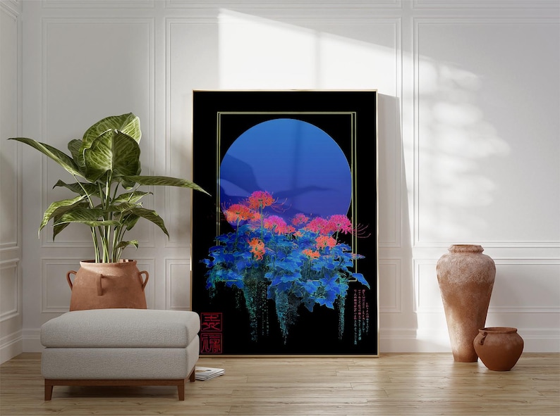 May include: A framed art print featuring a floral design with a blue moon backdrop. The artwork showcases vibrant orange and pink flowers against a black background, with gold trim. The print is displayed in a room with a plant, ottoman, and decorative vases.