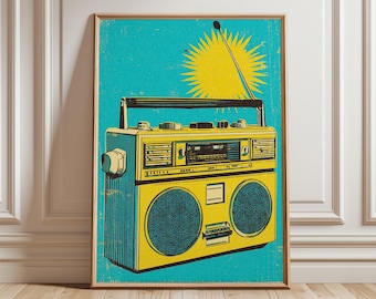 May include: A framed retro-style print featuring a yellow boombox against a teal background with a yellow sunburst. The boombox has two speakers, a handle, and an antenna. The artwork has a vintage, distressed look.