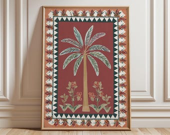 May include: Framed art print featuring a stylized palm tree illustration. The artwork has a red background with a green and white border. The palm tree is tan with green fronds, and there are floral accents at the base.