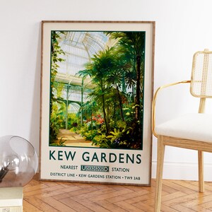 May include: A vintage poster advertising Kew Gardens in London. The poster features a colorful illustration of the Palm House, a large glass structure with lush greenery inside. The text on the poster reads "Kew Gardens, Nearest Underground Station, District Line - Kew Gardens Station - TW9 3AB."