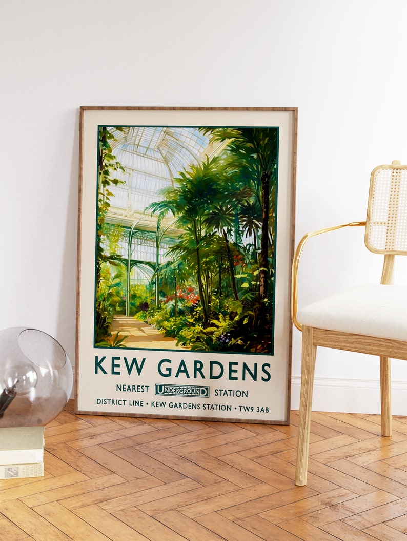 May include: A vintage poster advertising Kew Gardens in London. The poster features a colorful illustration of the Palm House, a large glass structure with lush greenery inside. The text on the poster reads "Kew Gardens, Nearest Underground Station, District Line - Kew Gardens Station - TW9 3AB."