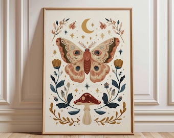 May include: A framed art print featuring a large butterfly with intricate wing patterns in shades of peach, brown, and cream. The design includes a crescent moon, stars, flowers, and a mushroom, all set against a cream background. The frame is a warm brown.