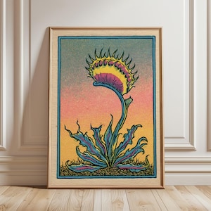 May include: A framed art print featuring a stylized Venus flytrap illustration. The plant has spiky, serrated leaves in shades of blue and pink, set against a gradient background transitioning from yellow at the bottom to blue at the top.