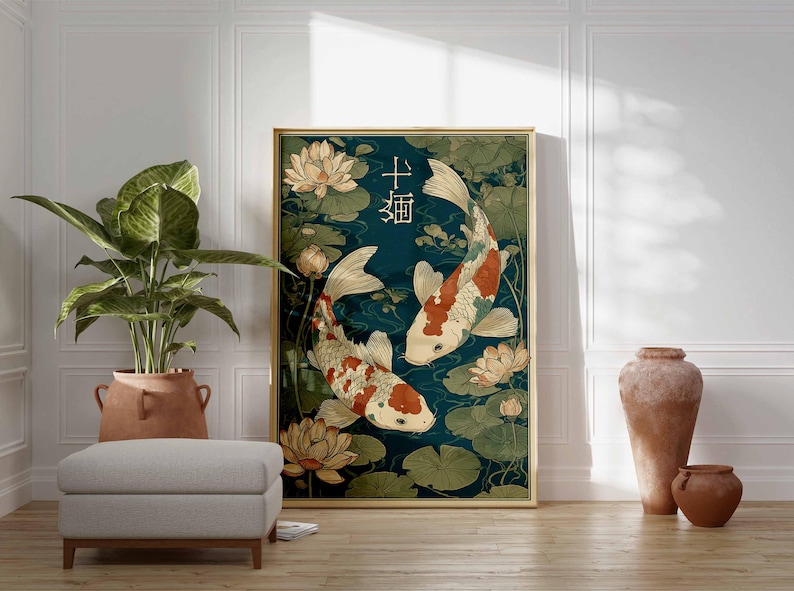 May include: A framed art print featuring two koi fish swimming in a pond with lily pads and lotus flowers. The artwork has a teal background and a gold frame. Japanese characters are at the top of the print.