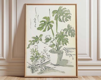 May include: A framed botanical print featuring a potted Monstera plant with large, green, split leaves. The artwork is rendered in a minimalist style with green and gray tones on a white background, set in a wooden frame.