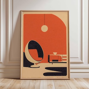 Peut inclure: Impression d'art encadrée de style moderne du milieu du siècle. Elle présente un fond orange avec un fauteuil œuf noir et crème, un petit meuble et une lumière suspendue. L'œuvre a un design rétro et minimaliste.