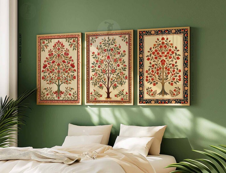 May include: Three framed prints of stylized floral trees with red flowers and green leaves on a cream background. The frames are gold with a black and red border.