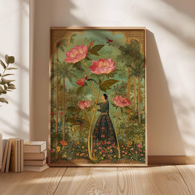 May include: A framed art print featuring a woman in a floral dress amidst a lush garden with large pink flowers. The artwork has a vintage aesthetic with a detailed, colorful illustration and a gold-toned frame.