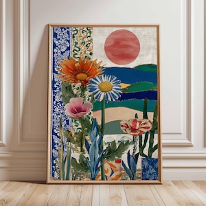 Peut inclure: Une impression d'art encadrée présentant un collage de fleurs et un paysage. L'œuvre comprend une marguerite gerbera orange, une marguerite bleue et blanche et une fleur rose. Un soleil rouge est dans la partie supérieure de l'impression.