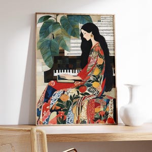 May include: A framed art print showing a woman playing a piano. She is dressed in a colourful patterned gown with fruit and floral designs. The artwork features a piano, sheet music, and large green leaves. The colour palette includes red, orange, and blue.