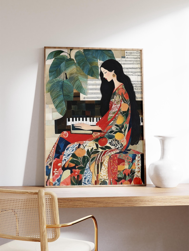 May include: A framed art print showing a woman playing a piano. She is dressed in a colourful patterned gown with fruit and floral designs. The artwork features a piano, sheet music, and large green leaves. The colour palette includes red, orange, and blue.