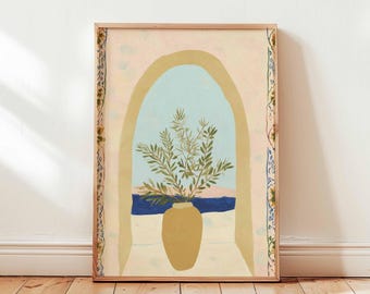 May include: A framed art print depicting a vase with green foliage, set against a window view. The window shows a blue sky, blue water, and a pink and beige landscape. The frame is a light brown colour.