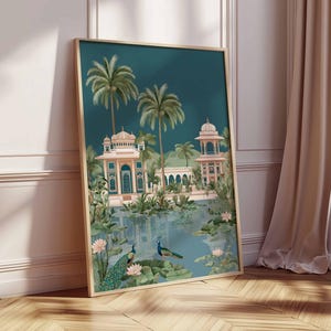 May include: Framed art print featuring a serene landscape with a teal sky and a reflective body of water. The artwork depicts ornate buildings, palm trees, and two peacocks. The color palette includes teal, pink, and green tones, creating a tranquil scene.