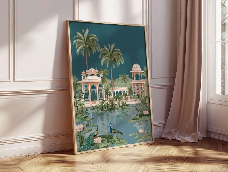 May include: Framed art print featuring a serene landscape with a teal sky and a reflective body of water. The artwork depicts ornate buildings, palm trees, and two peacocks. The color palette includes teal, pink, and green tones, creating a tranquil scene.