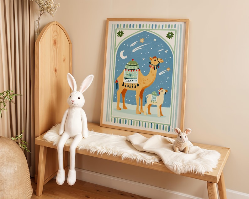 May include: A framed print featuring a camel and a smaller animal against a blue night sky with stars and a crescent moon. A white stuffed rabbit sits on a wooden bench with a faux fur runner, alongside a smaller rabbit toy.