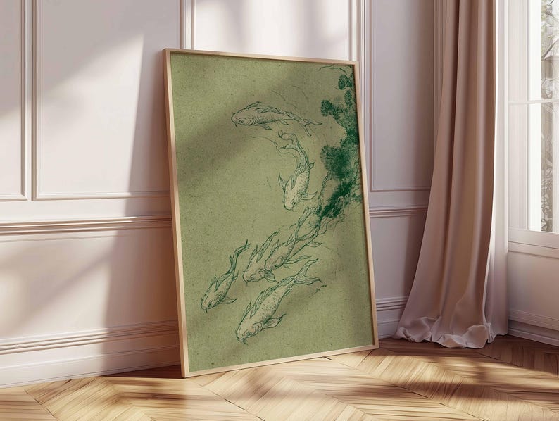 May include: A framed print featuring a sketch of koi fish in shades of green. The artwork is set against a muted green background, with the fish gracefully depicted. The frame is a light wood color, adding a natural touch to the piece.