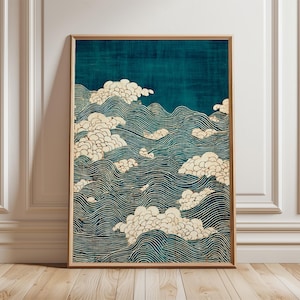 May include: Framed art print featuring a stylized depiction of ocean waves and clouds. The artwork uses a teal and cream color palette, with the waves rendered in a series of parallel lines. The clouds are depicted as fluffy, textured forms.