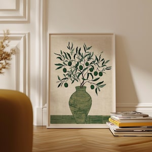 May include: A framed art print depicting a green vase holding an olive branch. The olive branch displays green olives and leaves. The vase is a darker green with a textured finish. The background is a light beige colour.