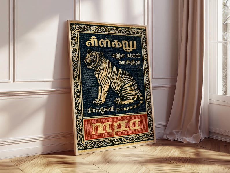 May include: A framed vintage-style poster featuring a tiger illustration. The tiger is depicted in gold and black against a dark blue background with ornate borders and text in a foreign language. The bottom section of the poster has red text.