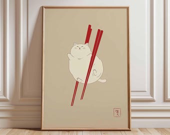 Puede incluir: Impresión artística enmarcada con una ilustración de un gato blanco sostenido por dos palillos rojos sobre un fondo beige. El gato tiene una pose relajada. Un pequeño carácter japonés está en la esquina inferior derecha.