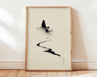 Könnte beinhalten: Ein gerahmter Kunstdruck mit einer minimalistischen Schwarz-Weiß-Berglandschaft. Das Kunstwerk zeigt einen gewundenen Pfad, der zu einer Bergkette führt, mit einem weichen, verschwommenen Effekt. Der Rahmen ist aus hellem Holz.