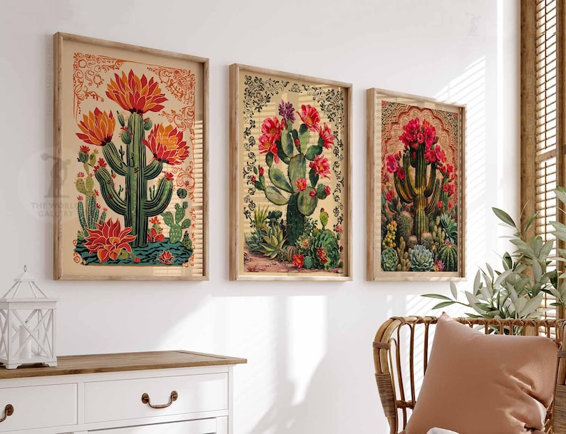 May include: Three framed botanical prints featuring cacti with red flowers and green leaves on a beige background. The prints are in wooden frames with a light brown finish.