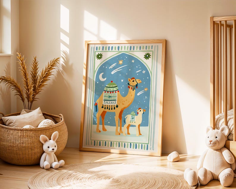 May include: A framed art print featuring a camel and a baby camel in a desert scene with a blue night sky, stars, and a crescent moon. The camel is tan with decorative saddlebags. The print is in a light wood frame.