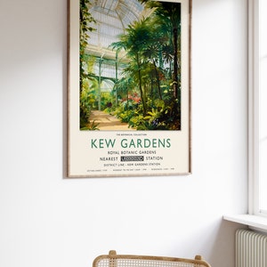 May include: A vintage poster advertising Kew Gardens, a botanical garden in London, England. The poster features a painting of a glass greenhouse filled with lush green plants. The text on the poster reads "Kew Gardens, Royal Botanic Gardens, Nearest Underground Station, District Line - Kew Gardens Station, Established 1759, Monday to Friday 10am - 5pm, Weekends 10am - 7pm."