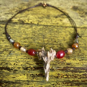 Chokerketting staartbeen