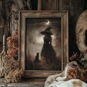 May include: Framed artwork depicting a witch in a long dress and hat, standing in a field with a black cat. The artwork is in a rustic wooden frame, with a crescent moon in the night sky. The color palette is muted with earthy tones.
