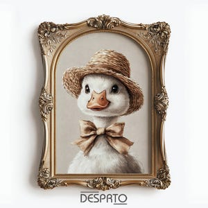 May include: A framed portrait of a duckling wearing a straw hat and bow tie. The duckling has white feathers, a brown beak, and dark eyes. The ornate gold frame surrounds the image, and the word "DESPRTO" is at the bottom.