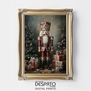 May include: A framed print featuring a Christmas-themed illustration. The artwork depicts a nutcracker soldier in a red uniform and crown, standing near a decorated Christmas tree and wrapped gifts. The frame is gold-colored, and the print has the text "DESPRTO DIGITAL PRINTS" at the bottom.
