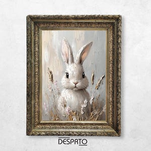 May include: A framed painting of a white rabbit with long ears, sitting in a field of tall grass and flowers. The rabbit has a soft, fluffy coat and is looking directly at the viewer. The painting is done in a realistic style with a textured brushstroke.