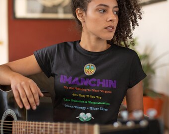 May include: A black t-shirt with a peace sign and the text "IMANCHIN" in purple. The text below the name reads "No Coal Mining In West Virginia It's Easy If You Try Less Pollution & Hospitalization Clean Energy = Bluer Skies".