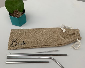May include: A set of four stainless steel drinking straws with a cleaning brush, packaged in a burlap bag with the word "Bride" printed on it.