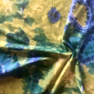 vintage stretch spandex fabric in blue, green and purple tie dye design