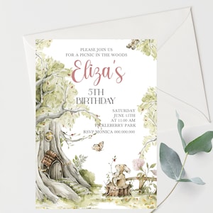 May include: A woodland-themed birthday invitation with a watercolor illustration of a tree with a small house in its trunk, a rabbit sitting on a stump, and butterflies. The text reads "Please join us for a picnic in the woods Eliza's 5th Birthday Saturday June 15th at 11:00 AM Pickleberry Park RSVP Monica 000.000.000".