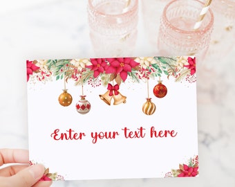 May include: A white card with a watercolor Christmas design featuring red poinsettias, gold and red ornaments, and bells. The card has the text "Enter your text here" in red. Four pink glasses with gold and white striped straws are in the background.