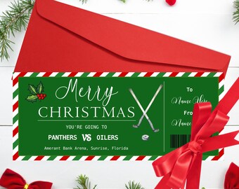 May include: A red envelope with a Christmas hockey ticket. The ticket has a green background with the words "Merry Christmas" and "Panthers vs Oilers". The ticket also includes hockey sticks and a puck.