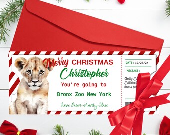 May include: A red Christmas card with a lion cub illustration and the text "Merry Christmas Christopher, You're going to Bronx Zoo New York". The card is in a red envelope with a red ribbon.