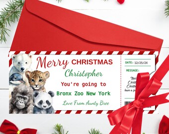 May include: A red envelope with a Christmas ticket design. The ticket reads "Merry Christmas Christopher, You're going to Bronx Zoo New York." The ticket features illustrations of various zoo animals. A red ribbon and bow are also present.