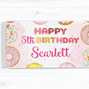 May include: Pink and white donut-themed birthday card with the text "Happy 5th Birthday Scarlett".