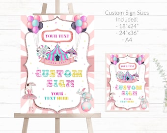 May include: Pink and white printable sign with a circus theme. The sign features a pink and white striped tent, a Ferris wheel, a carousel, a pink and white striped background, and the text "Custom Sign".