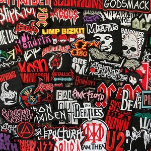 May include: A collection of embroidered patches featuring band logos and names, including "Misfits," "Ramones," "Pink Floyd," and "Black Sabbath." The patches are in various colors, with black, red, and white being prominent.