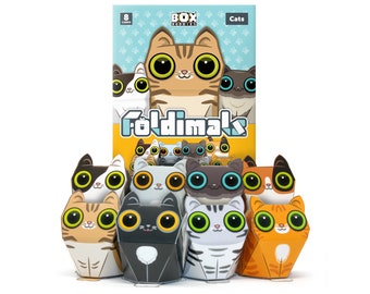 Puede incluir: Un conjunto de ocho figuras de papel de gato para doblar. Los gatos son de varios colores y patrones, incluyendo naranja, negro, blanco y gris. La caja dice "Foldimak" y "Cats".