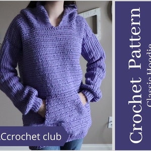 May include: A purple crochet hoodie with a hood and a pocket. The hoodie is made with a simple stitch pattern. The text "@ACcrochet club" is visible in the bottom left corner of the image. Crochet Pattern Classic Hoodie.