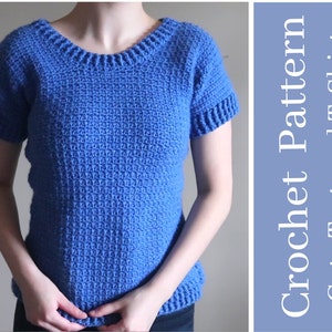 May include: A blue crochet T-shirt with a textured pattern. The short-sleeved shirt has a ribbed neckline and sleeve cuffs. The text on the right says "Crochet Pattern Cute Textured T-Shirt".
