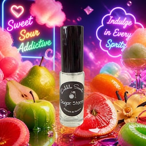 May include: A clear glass perfume bottle with a black cap and a circular label reading Dabble Scents Sugar Storm Extrait de Parfum. The bottle is centered against a vibrant, neon-lit background featuring stylized fruit, candy, and text.