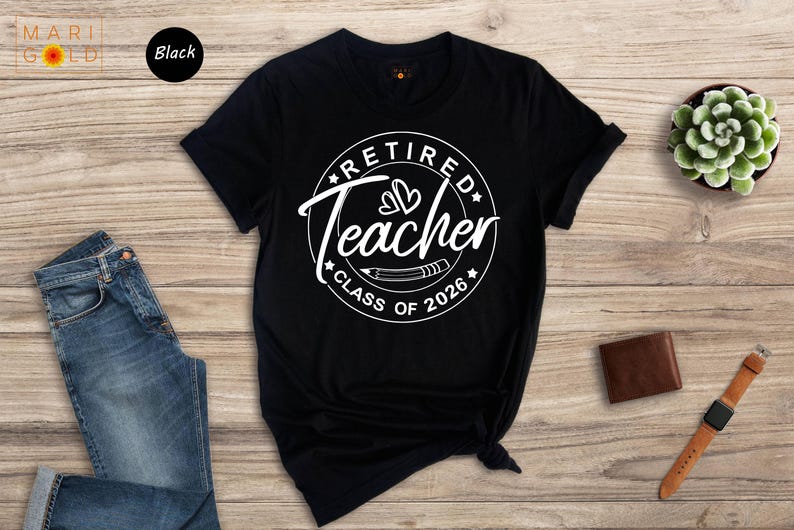a black t-shirt with a white graphic design, a pair of blue jeans, a brown wallet, a watch, and a small potted plant on a wooden surface.